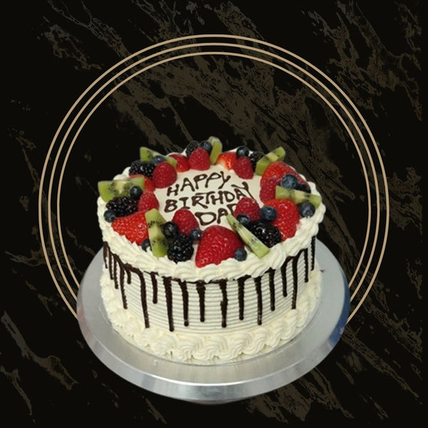 Custom birthday cake with edible photo topper and piped borders from The Bakers Shop in Birmingham