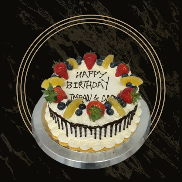 Pastel-colored birthday cake with smooth buttercream and elegant piping from The Bakers Shop in Birmingham