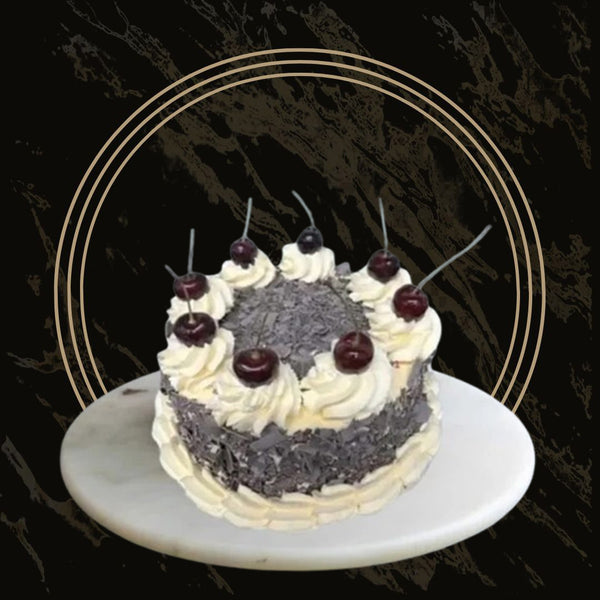 Classic Black Forest cake with layers of chocolate sponge, cream, and cherries from The Bakers Shop in Birmingham
