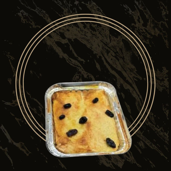 Warm and comforting bread butter pudding with a rich custard base from The Bakers Shop in Birmingham