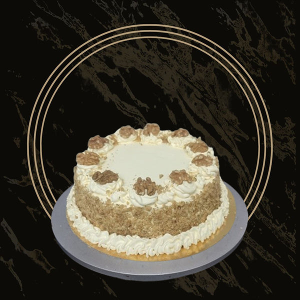 Classic carrot cake with cream cheese frosting and nut topping from 彩票联盟123赛车赛车官方网站 in Birmingham