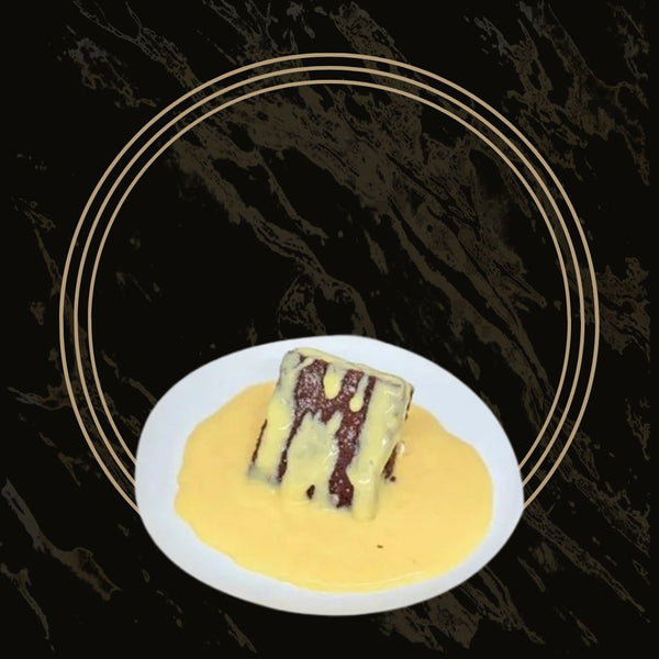 Rich chocolate concrete cake served with creamy custard from The Bakers Shop in Birmingham