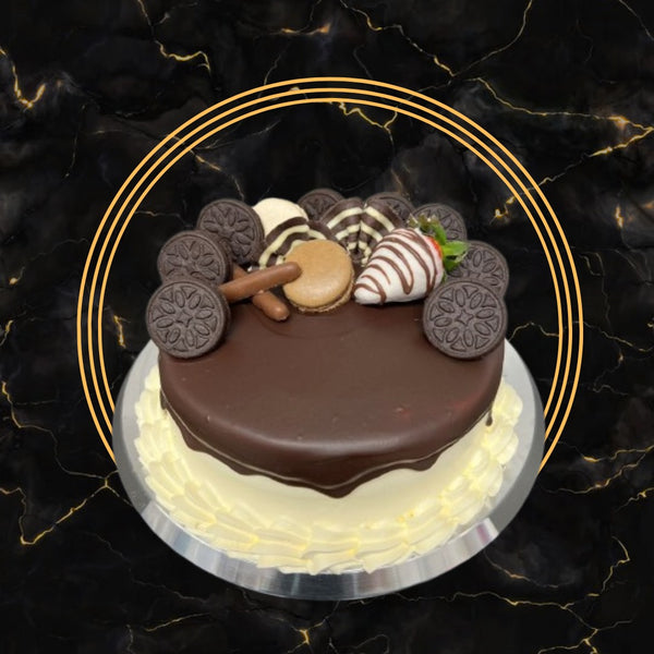Chocolate Delight Drip Cake topped with Oreos, macarons, and chocolate-dipped strawberries – The Bakers Shop Birmingham