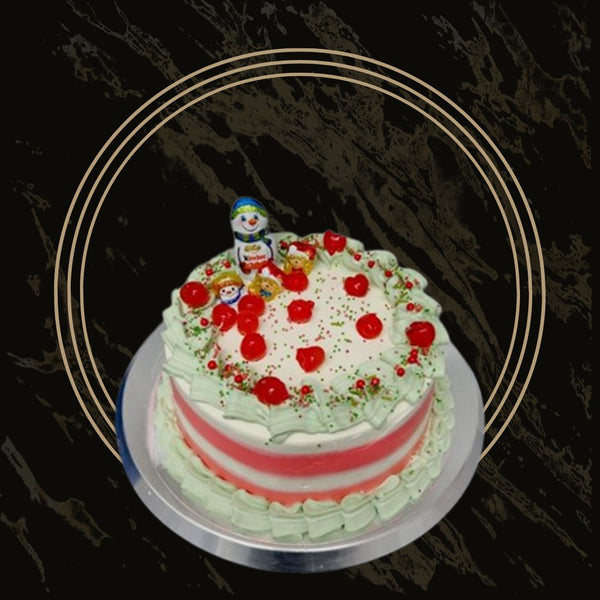 Christmas cake decorated with white snowflakes and red icing from The Bakers Shop in Birmingham