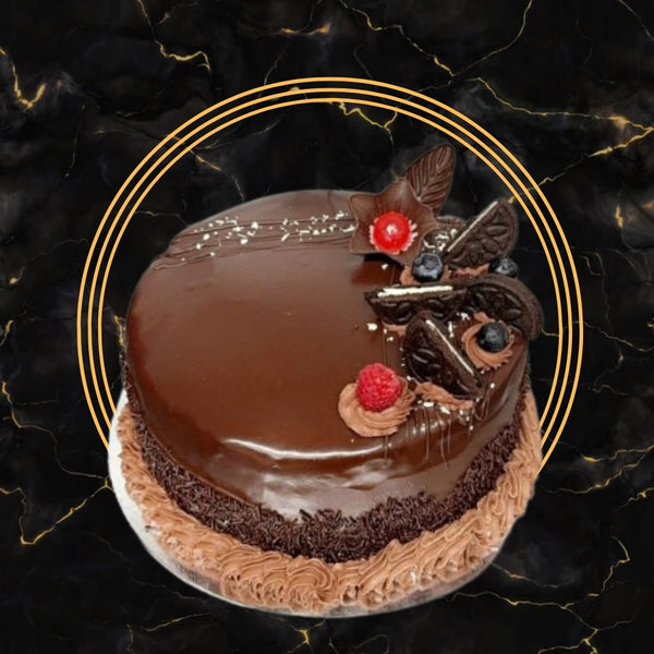 Deluxe chocolate glaze cake decorated with Oreos, berries, and chocolate cream