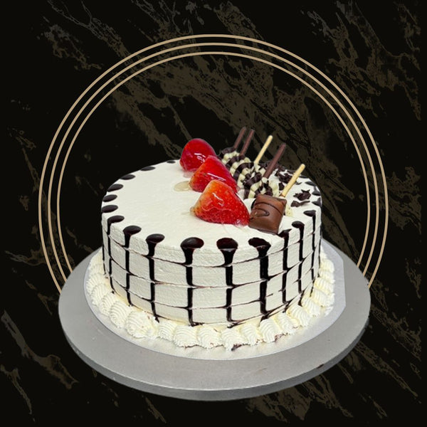 Custom fancy cake with a name topper and delicate piping from The Bakers Shop in Birmingham
