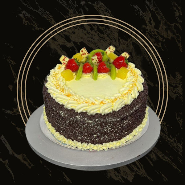 Classic fruit cake topped with mixed dried fruits and nuts from The Bakers Shop in Birmingham