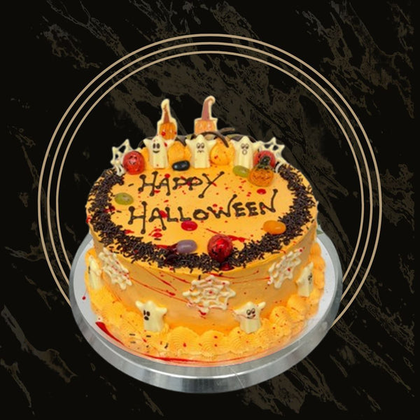Happy Halloween celebration cake with festive orange and black decorations, pumpkins, and sprinkles from 彩票联盟123赛车赛车官方网站 in Birmingham