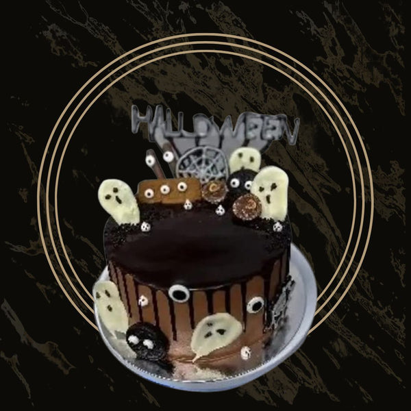 Hauntingly sweet Halloween cake with eerie purple icing, spiderweb design, and edible ghosts from 彩票联盟123赛车赛车官方网站 in Birmingham
