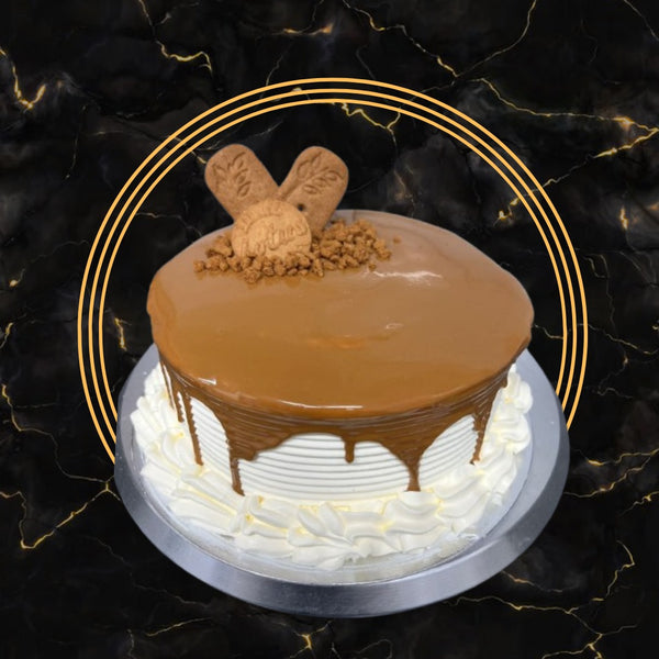 Lotus Biscoff cake with caramel drip and biscuit topping