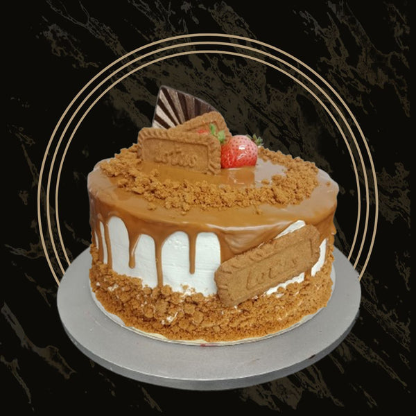 Round Lotus cake with biscuit topping and buttercream swirls from The Bakers Shop in Birmingham