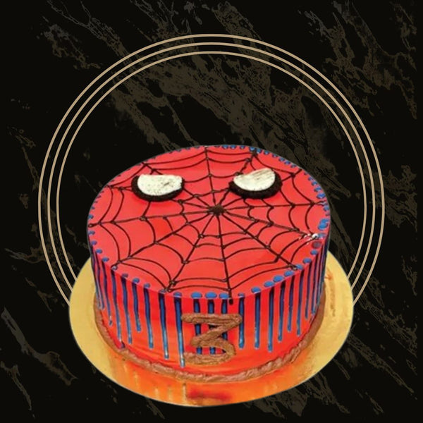 Spider-Man themed birthday cake with red and blue web design from The Bakers Shop in Birmingham