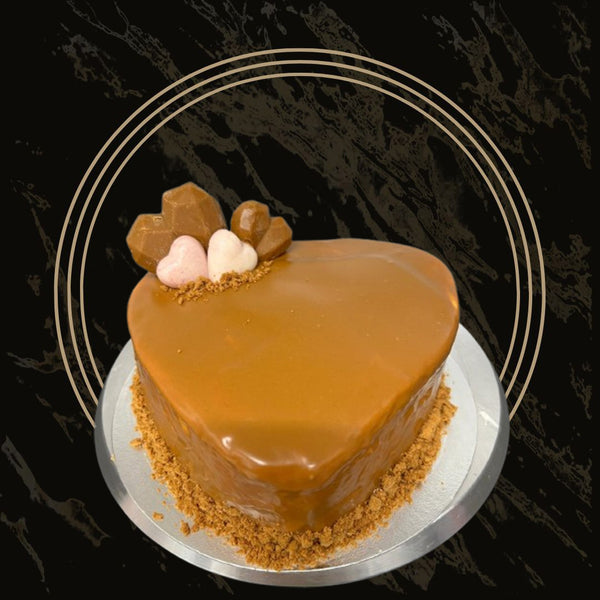  Elegant Valentine’s Day cake topped with rose petals and delicate cream swirls from The Bakers Shop in Birmingham